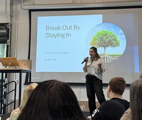 Allie Hager presenting Break Out by Staying In with her Rooted Framework tree slide behind her